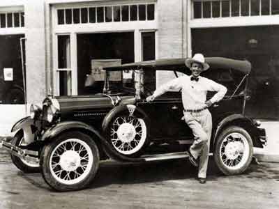 man standing by Ford